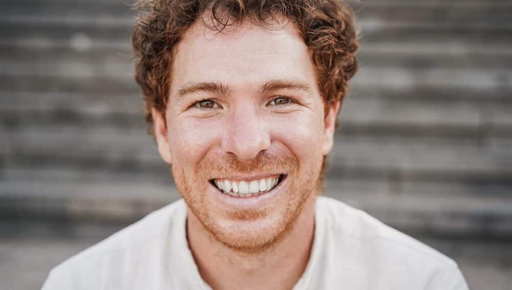 Young,Man,Smiling,On,Camera,Having,Fun,Outdoor,In,The