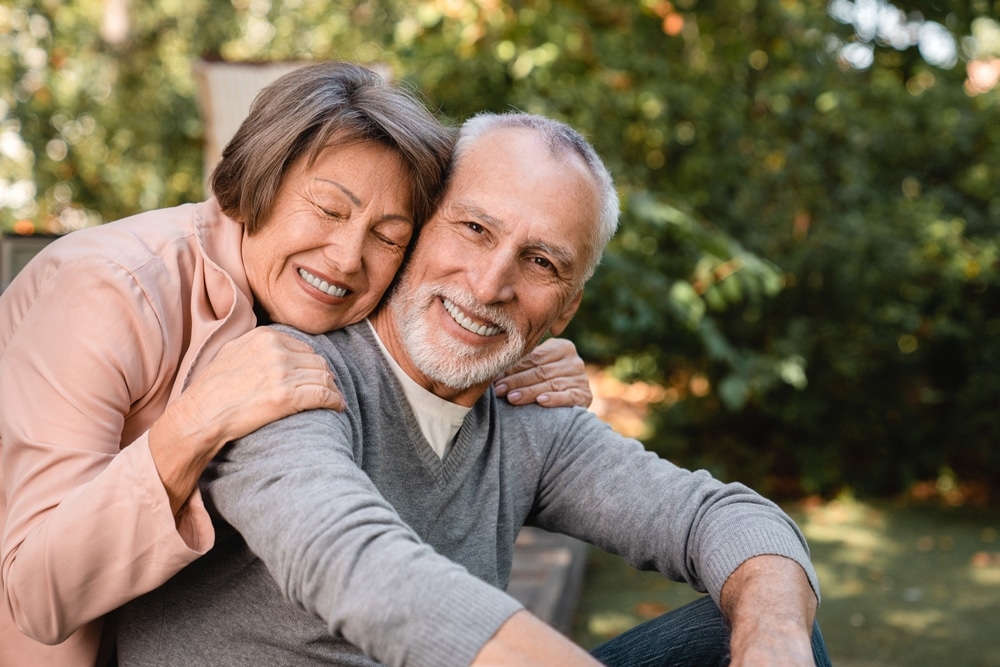 Cheerful,European,Senior,Old,Elderly,Couple,Grandparents,Spouses,Hugging,Embracing