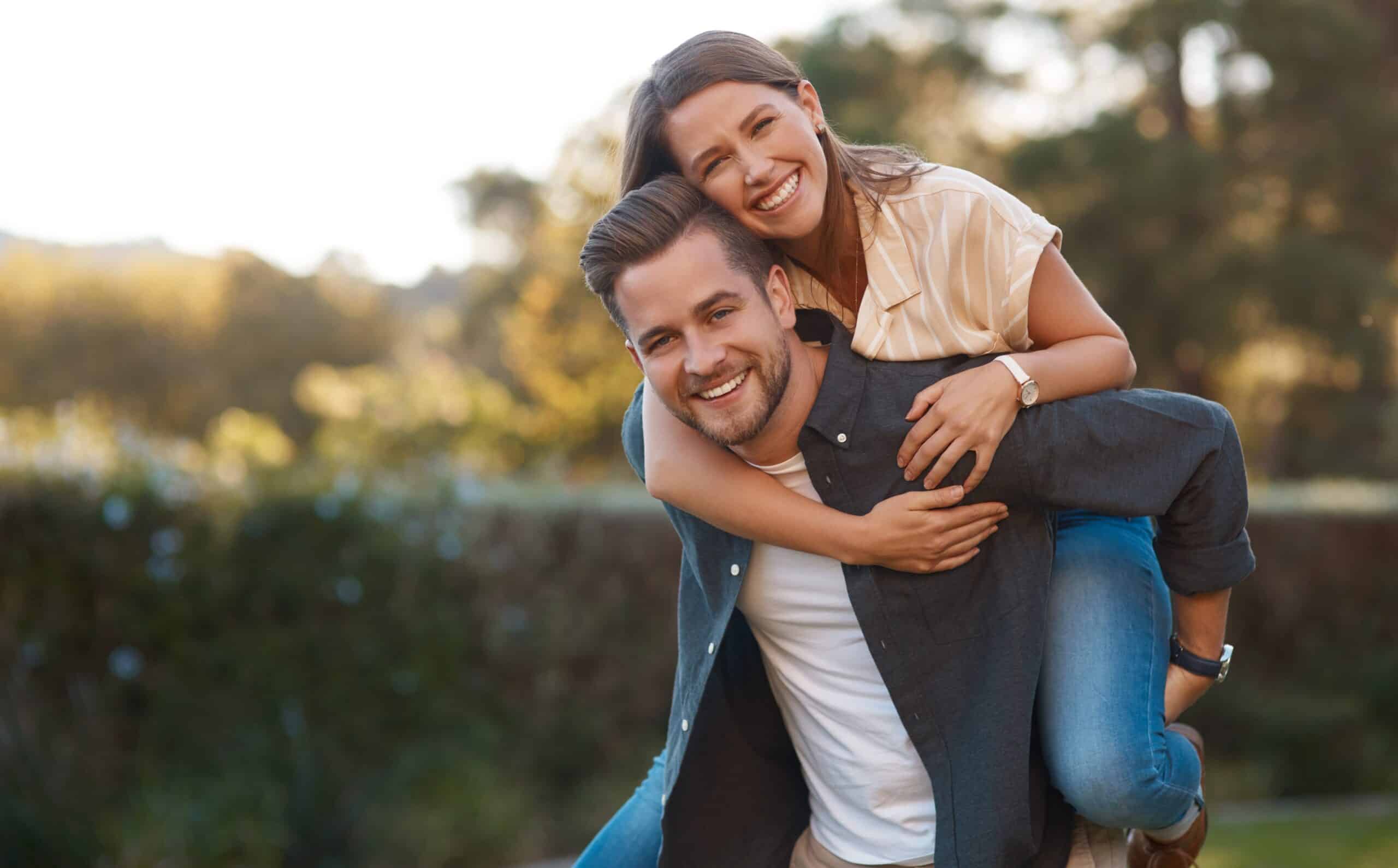 Man,,Woman,And,Portrait,With,Piggyback,In,Park,For,Relationship