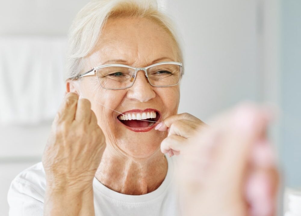 Portrait,Of,An,Elderly,Senior,Woman,Is,Cleaning,Brushing,His